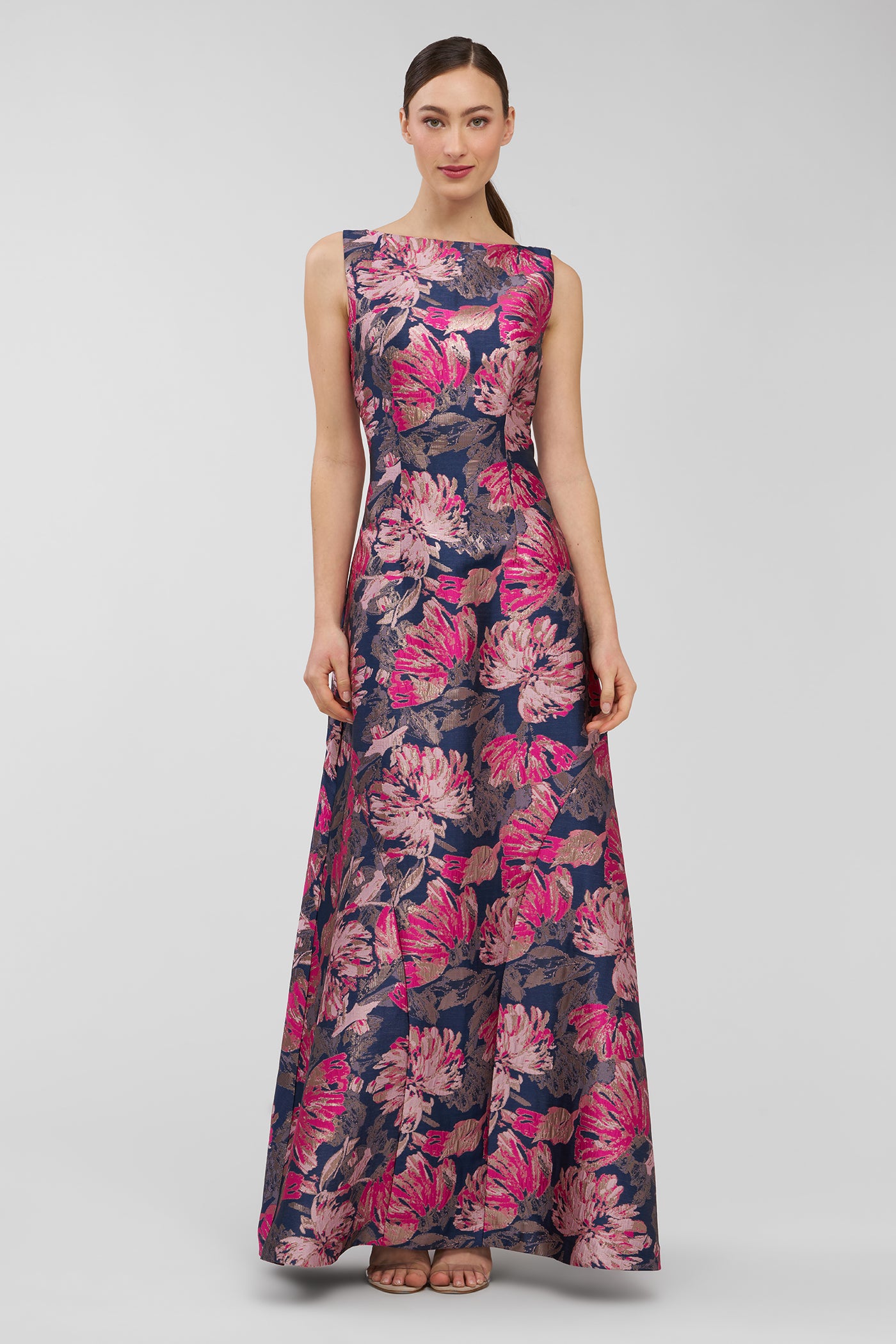 Woman wearing a floral dress on a gray background