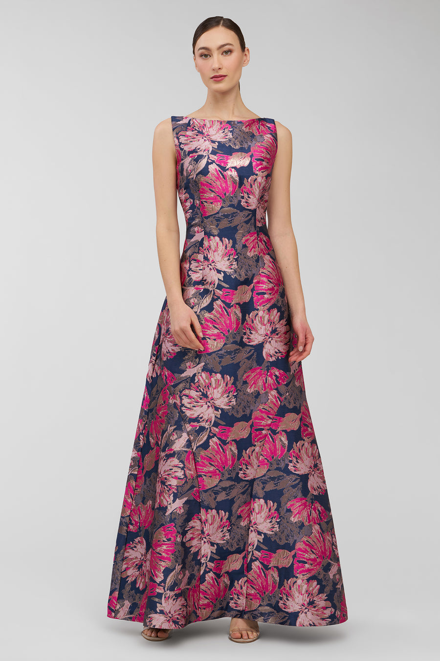 Woman wearing a floral dress on a gray background
